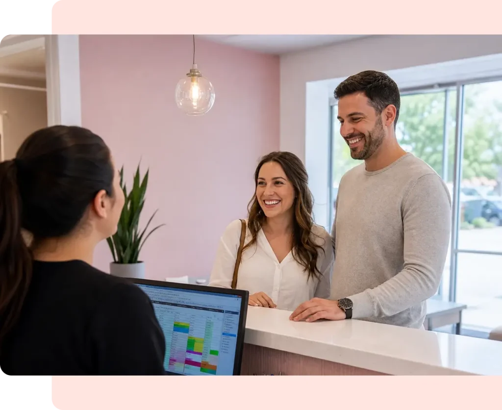 Couple at front desk of Aurora Smile Altamonte