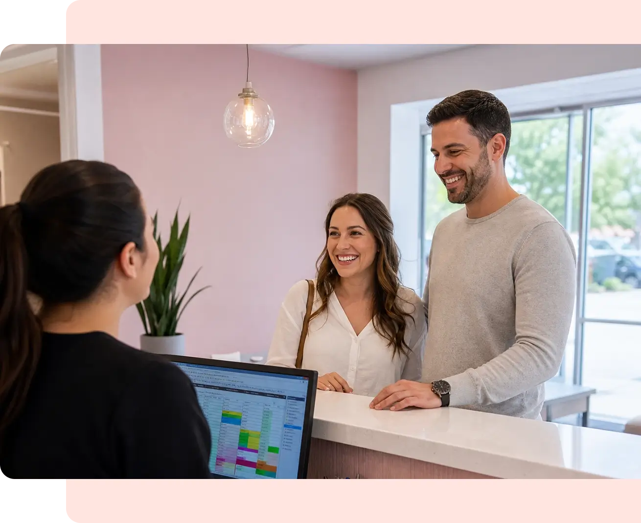 Couple at front desk of Aurora Smile Altamonte