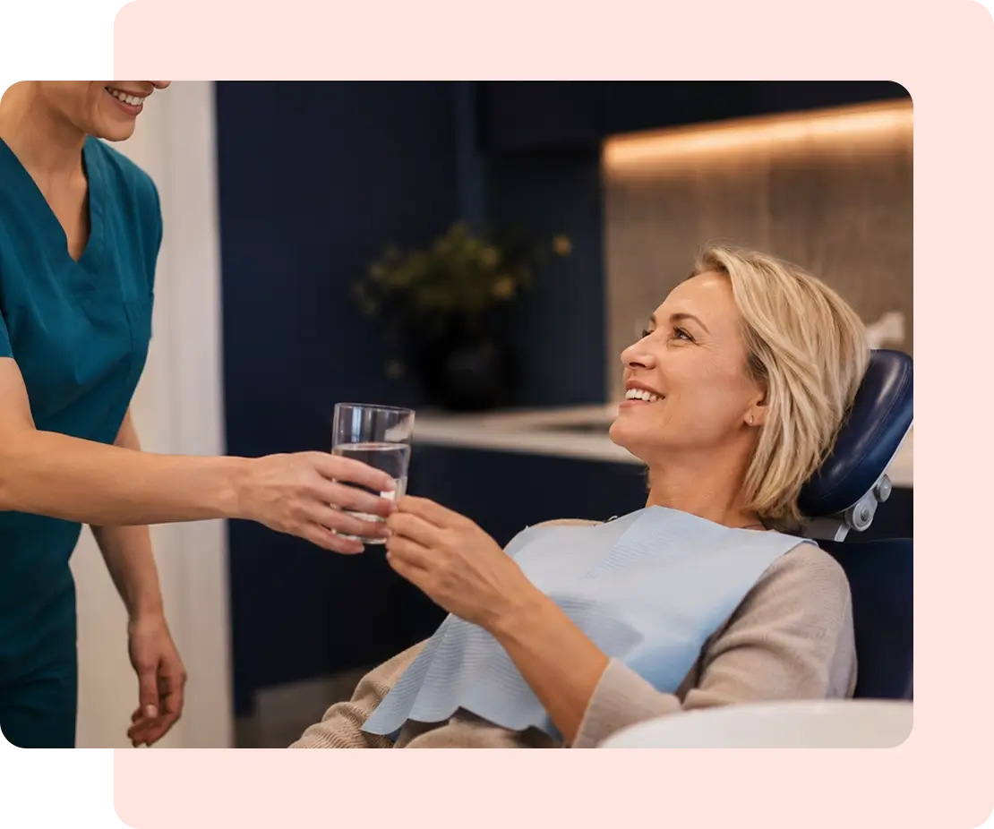 patient receiving water after a dental surgery